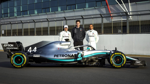 Team Mercedes: (from left) Valtteri Bottas, team principal Toto Wolff and five-time world champion Lewis Hamilton with their new car for the 2019 F1 season.