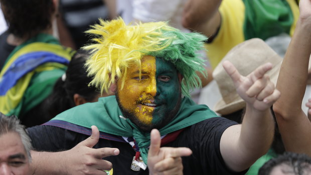 Supporters of Brazil's President Elect Jair Bolsonaro wait prior Bolsonaro's inauguration.