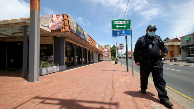 Police outside the pizza bar where the man worked.