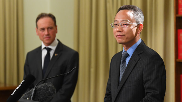 China’s consul-general for Victoria Zhou Long (right) and Health Minister Greg Hunt.