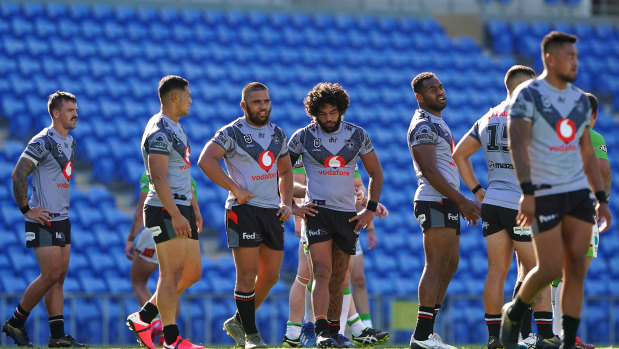 The Warriors look on following a Raiders try at CBUs Super Stadium on the Gold Coast.