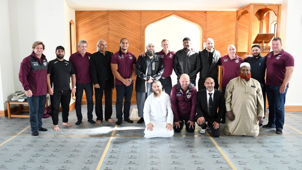Paying respect: Manly players and staff with worshippers at the Al-Noor mosque.