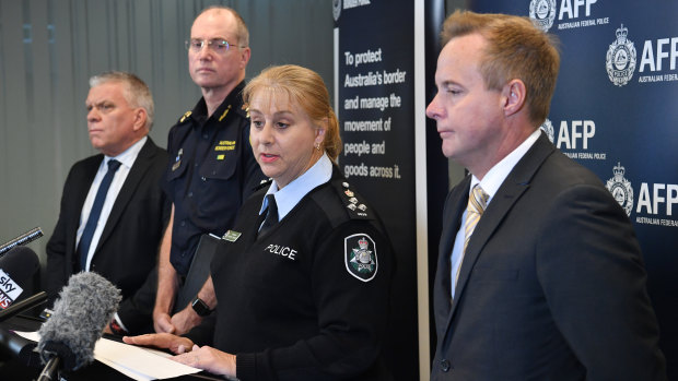 Queensland Police Detective Superintendent Jon Wacker (left), Australian Border Force State Commander Terry Price (second left), AFP Queensland Commander Sharon Cowden (centre) and AFP Detective Superintendent Russell Smith (right) address the media on Friday. 