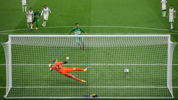 Nikita Rukavytsta puts a penalty past Tottenham Hotspur goalkeeper Joe Hart in the Europa League.
