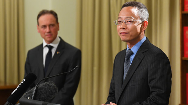 China’s consul-general for Victoria Zhou Long (right) and Health Minister Greg Hunt.