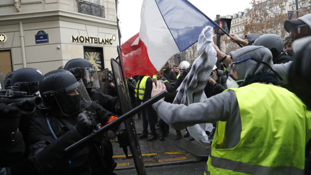 Bad for business: yellow vest demonstrators have put a dent in retail sales in France.