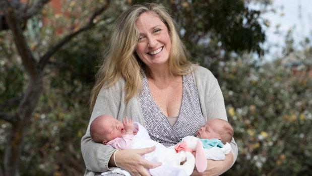 Manda Epton, 50, with her three-week-old baby girls. 