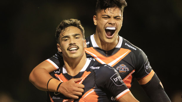 Daine Laurie and Tommy Talau celebrate a first-half try.