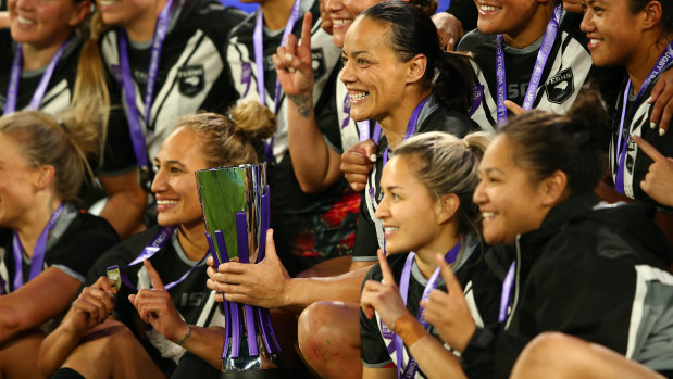 Kiwi Ferns captain Honey Hireme (with the trophy) and her teammates celebrate their thrilling win on Saturday night.