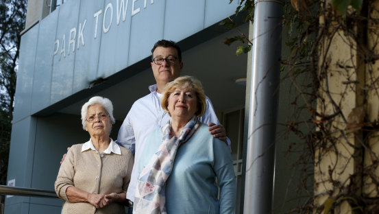 Albertina Martins, John Lowndes and Felicia Benga are residents of  South Melbourne's Park Towers. Mr Lowndes said the two women often cleaned their hallways and their level's laundry rooms - something GJK is contracted to do.