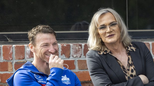 Dani Laidley (right) with former North Melbourne player Brent Harvey at a club function last year.