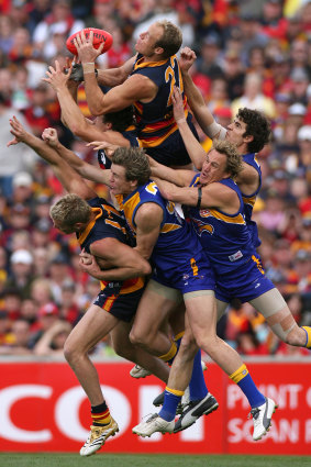 Adelaide’s Ian Perrie tries to mark in the pack.