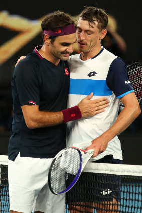 John Millman, right, congratulates Roger Federer after their third-round showdown at the 2020 Australian Open.