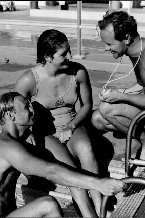 Australian sprint hopes for Rome, Jon Hanricks and Dawn Fraser chat with coach Harry Gallagher later in 1960.