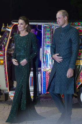 Britain's Prince William and his wife Kate arrive in a traditionally painted motorised rickshaw to attend a reception in Islamabad, Pakistan in 2017.