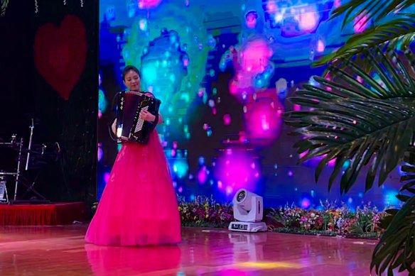 A North Korean musician plays the accordion during a Saturday dinner show at the Pyongyang Okryu-Guan restaurant in Beijing.