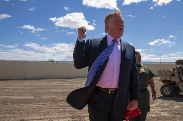 Trump speaks at a new section of the border wall with Mexico in April 2019.