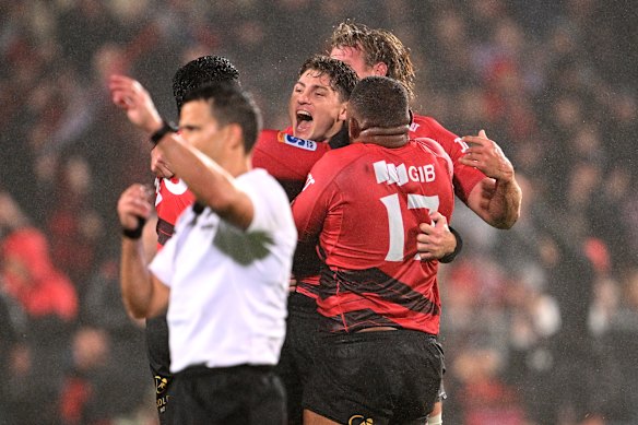 James O’Connor of the Crusaders celebrates with his team after kicking the winning penalty during the round 10 Super Rugby Pacific match between Crusaders and Blues