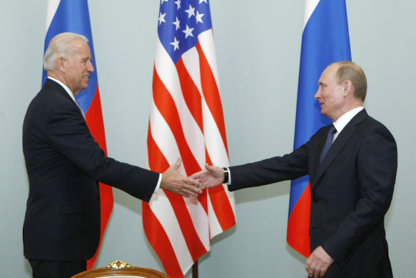 Joe Biden and Vladimir Putin shake hands in Moscow in 2011. The pair will meet again next month.