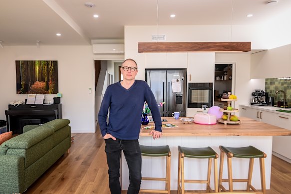 Ben Schrever in his prefab home. He says prefab homes are built faster and can save owners money in rent.