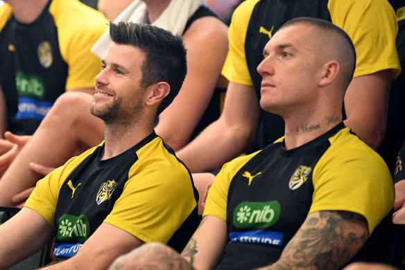 Trent Cotchin and Dustin Martin watch on as Jack Riewoldt announces his retirement.
