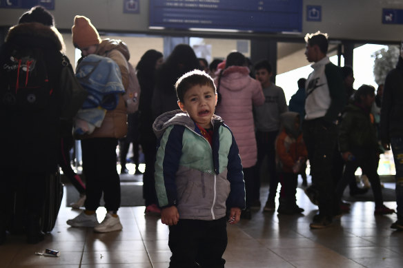 A refugee boy who fled conflict from neighbouring Ukraine cries at the railway station after arriving in Zahony, Hungary on Sunday.