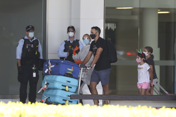 Australians who were stranded overseas arrive in Canberra after a repatriation flight from Singapore in November.