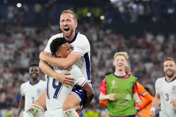 Harry Kane celebrates with Ollie Watkins.
