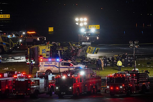 A fire truck lying on its side after colliding with an Air Canada plane. 