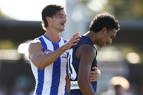 Jy Simpkin has a laugh with Latrelle Pickett.