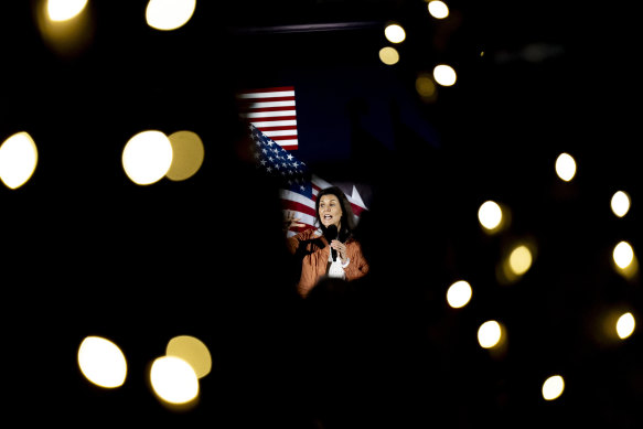 Republican presidential candidate former UN Ambassador Nikki Haley, seen through lights.