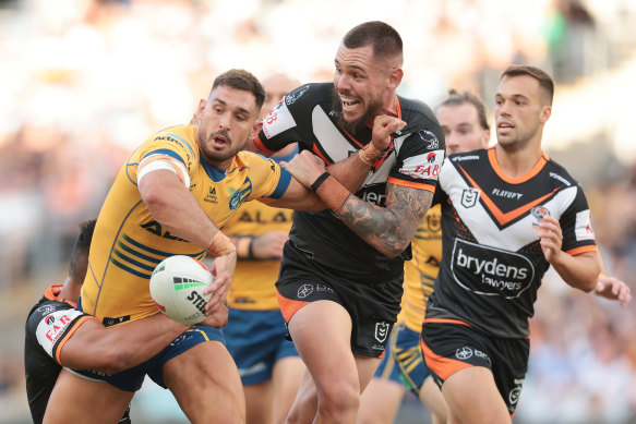 Ryan Matterson offloads against the Tigers at Accor Stadium.