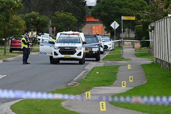 Evidence markers on the footpath at the crime scene in Glenmore Park.