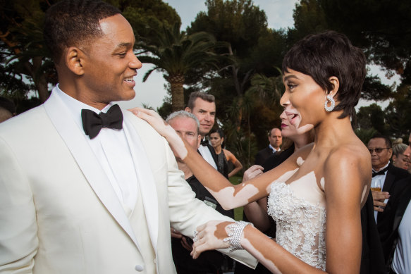 “I never would’ve been able to talk about that while he was alive,” Will Smith, pictured with model Winnie Harlow in France in 2017, said in an interview with GQ magazine about his late father, who physically abused his mother and propelled Smith into a lifetime of people pleasing.