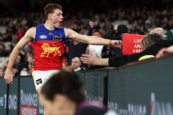 Logan Morris plays it up to the crowd at the MCG.