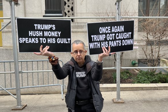 Anti-Trump demonstrator Laurie Arbeicer outsider the Manhattan court where he could soon be indicted.