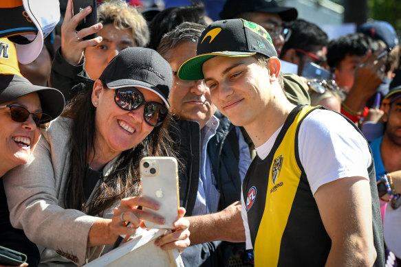 Melbourne-born driver Oscar Piastri greets fans at Albert Park.