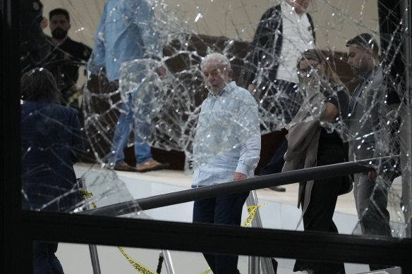 Brazilian President Luiz Inacio Lula da Silva inspects the damange at the Planalto Palace after it was stormed by supporters of his predecessor Jair Bolsonaro in Brasilia on January 8.