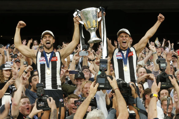 Brothers and Collingwood stars Josh and Nick Daicos celebrate the 2023 premiership.