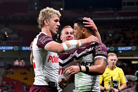 Tommy Talau celebrates his try.