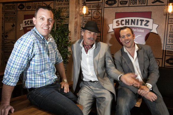 Schnitz founder Roman Dyduk (centre) with his sons Tom and Andrew.