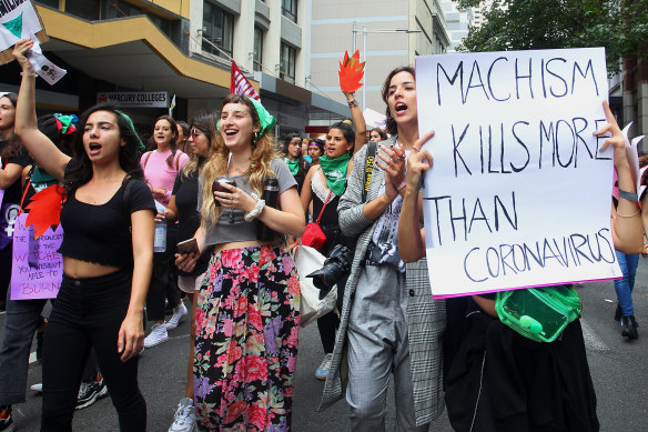 Women marching on International Women's Day on Sunday.