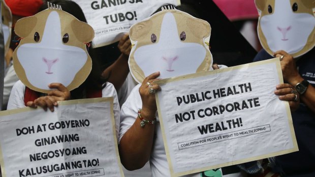Protesters wear Guinea Pig masks to condemn the controversial immunisation of more than 700,000 Filipino children with the anti-dengue vaccine Dengvaxia in Manila, Philippines on December 18, 2017. 