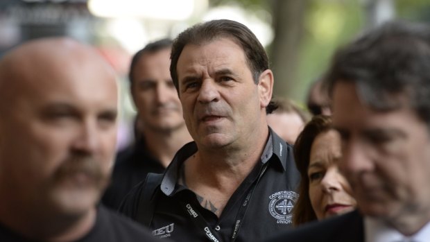 John Setka (centre) at a court hearing in 2016.