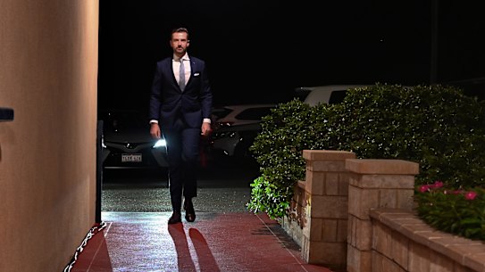 Opposition Leader Zak Kirkup arrives as a solitary figure at his election day function to concede the election for the second time.