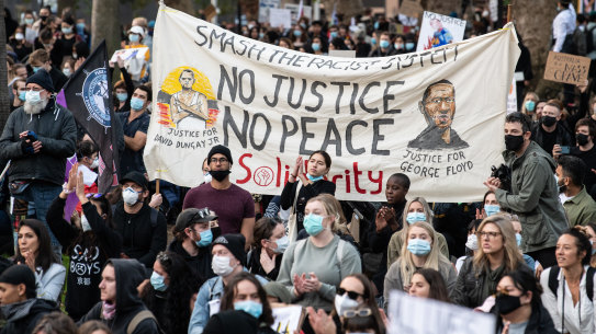 A Black Lives Matter protest in Sydney, where protesters held a banner for both George Floyd in the US and David Dungay Jr in Australia. 