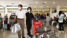 Inbound tourists disembark from the first flight into Sydney from China. 