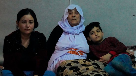 Zena Kalo with her mother-in-law adn family in a tent they share with her sister-in-law in Kabarto camp, northern Iraq, on Friday.