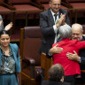 Senator Patrick Dodson is embraced by Senator Penny Wong after he delivers his valedictory speech. 