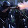 A police officer fires a “soft” round during the protests in Los Angeles.